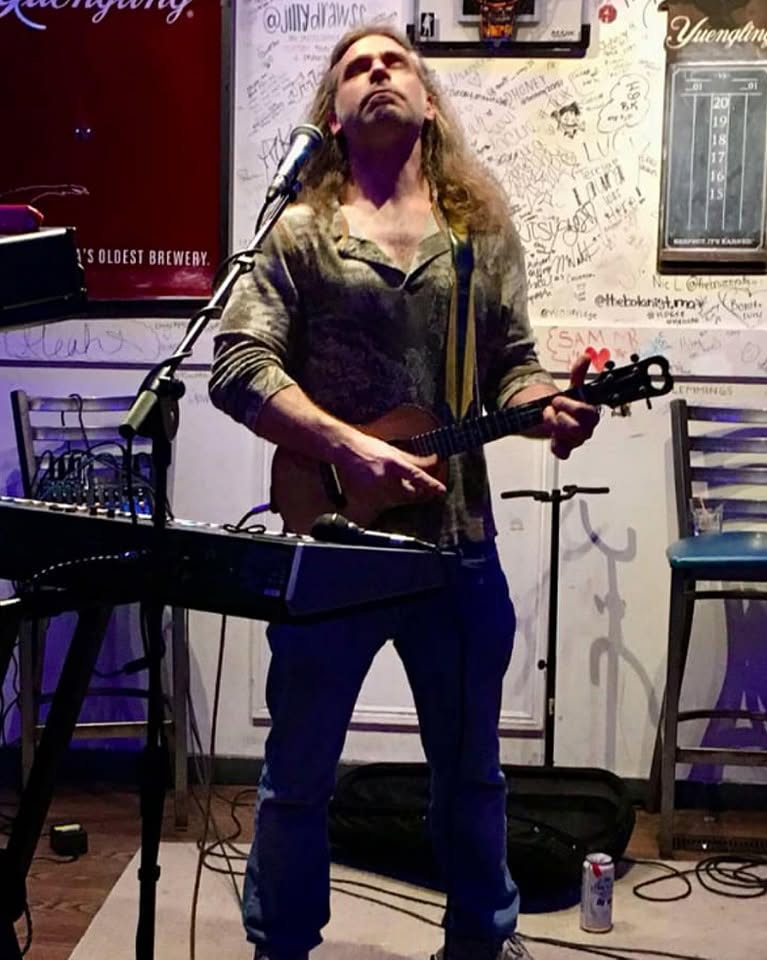 Ukulele Russ performing live in a brewery